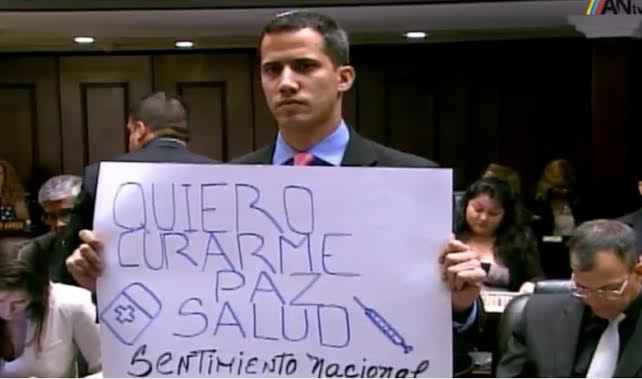 diptado Guaido con pancarta